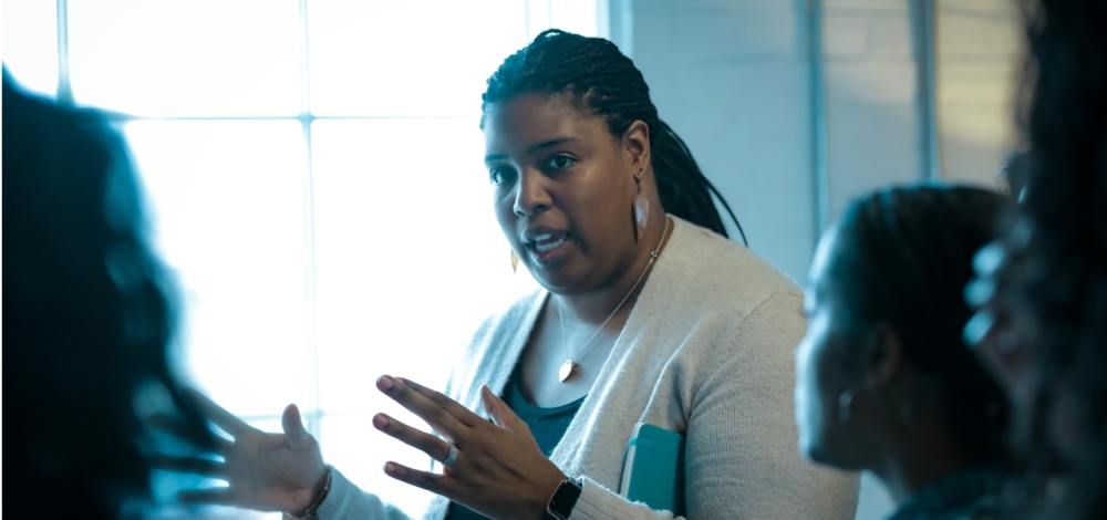 A woman speaking to a group