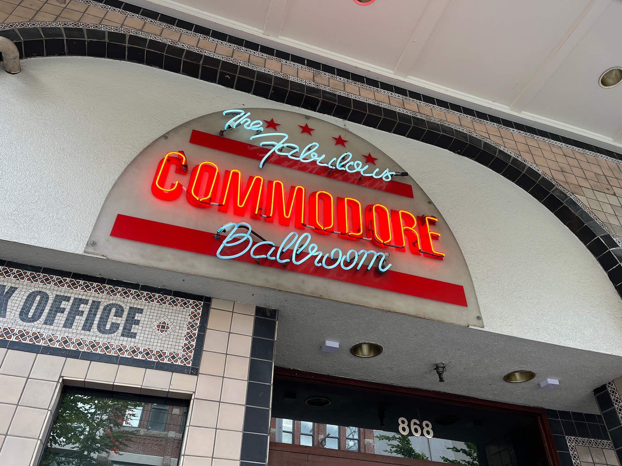 Close-up view of the neon sign above the Commodore Ballroom’s entrance doors.
