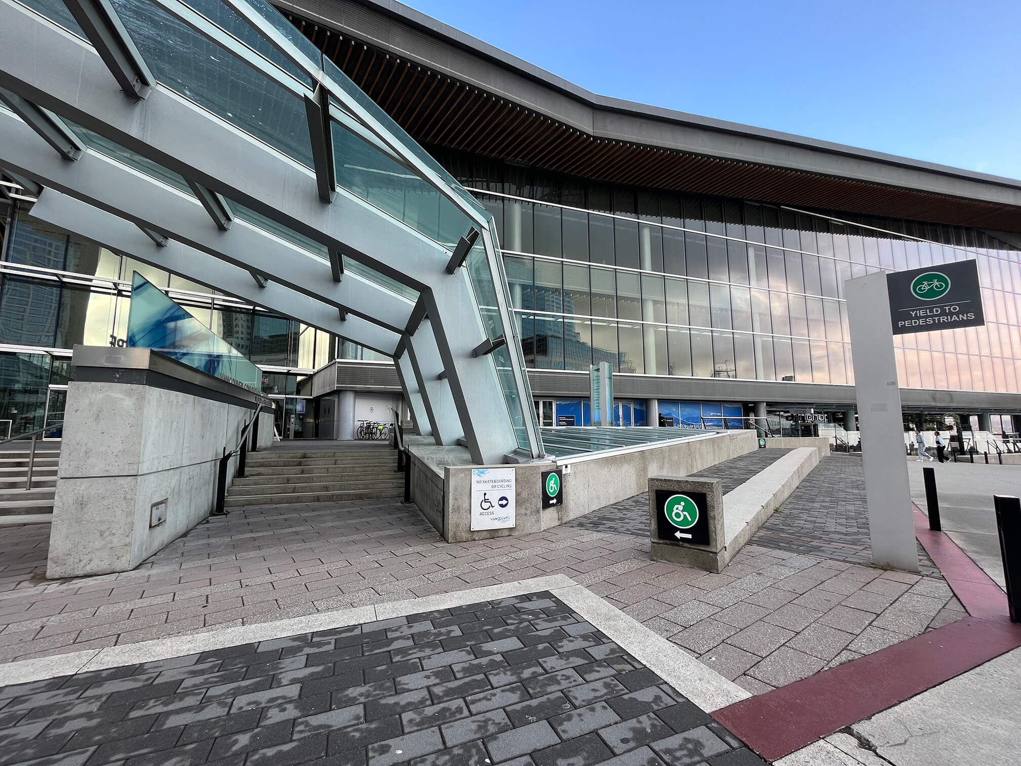 Photograph of the ramp that is adjacent to the stairs to the entrance of Vancouver Convention Centre West.