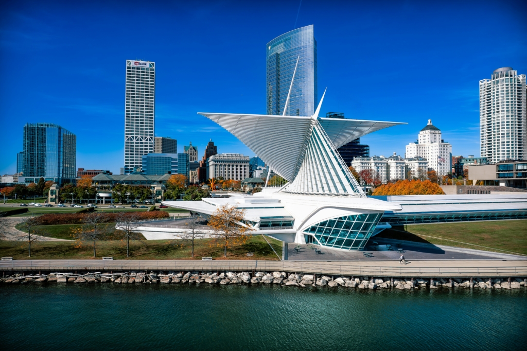 A beautiful view of the Milwaukee Art Museum taken from the perspective of Lake Michigan on a bright, clear day.